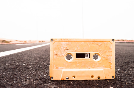 Ancient Retro Musicassette on the Asphalt Roadの写真素材