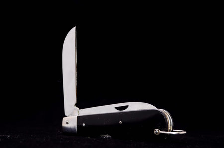 Vintage Black Knife Tool on a Dark Background