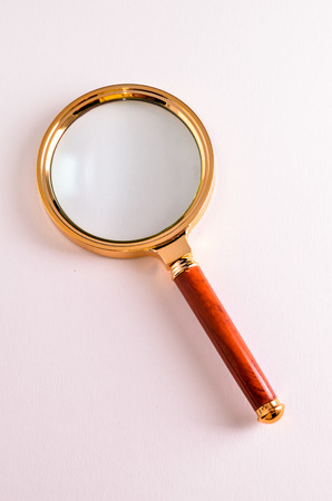 Vintage Magnify Glass Loupe on a White Backgroundの写真素材