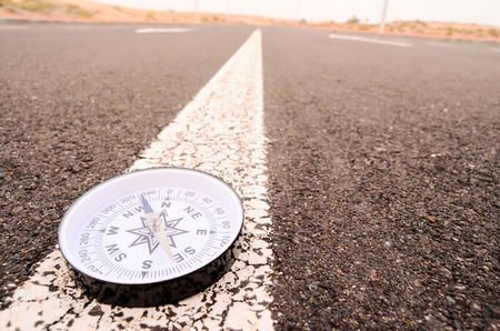 Travel Concept Compass on the Asphlat Roadの写真素材