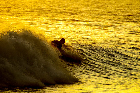 Silhouette Surfer at Sunset in Tenerife Canary Island Spain