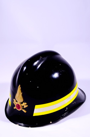 Black Italian Firefighter Helmet on a White Backgroundの写真素材