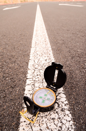 Travel Concept Compass on the Asphlat Roadの写真素材