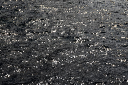 Blue Still Sea Water With Ripple. Natural Background Photo Texture