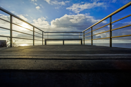 Sunrise on a Pier over Atlantic Ocean in Tenerife Canary Islands Spainの写真素材