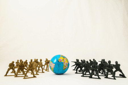 Plastic Lead Soldiers Representing War on a White Backgroundの写真素材