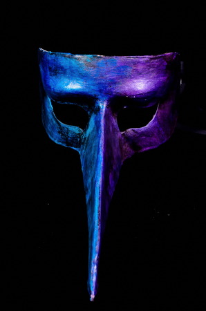 Traditional Venice Mask with Big Nose isolated over a Black Backgroundの写真素材