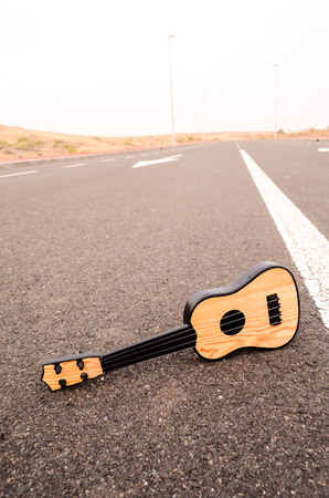 Classical Guitar on the Asphalt Countryside Roadの写真素材
