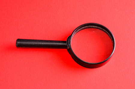 Vintage Magnify Glass Loupe on a Colored Background
