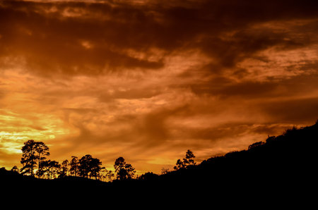 Sun behind a Mountain Silhouette in Gran Canaria Spainの写真素材