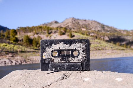 Ancient Retro Musicassette on the Rock into the Wildの写真素材