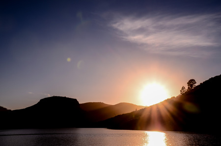 Sun over a Mountain Silhouette in Gran Canaria Spainの写真素材