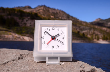 Time Concept Classic Vintage Pocket Clock on the Volcanic Rocks