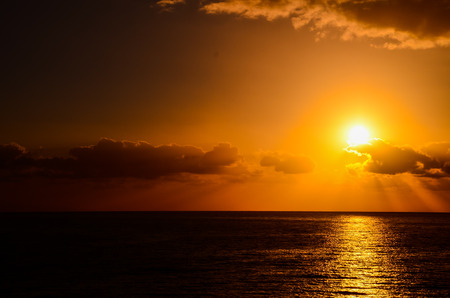Orange Still Sea Water With Ripple. Natural Background Photo Textureの写真素材