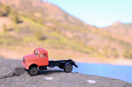 Transportation Concept Old Toy Truck on the Rocksの写真素材