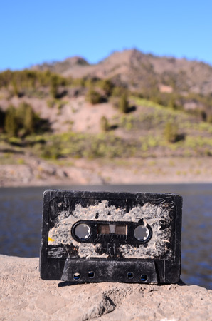 Ancient Retro Musicassette on the Rock into the Wildの写真素材