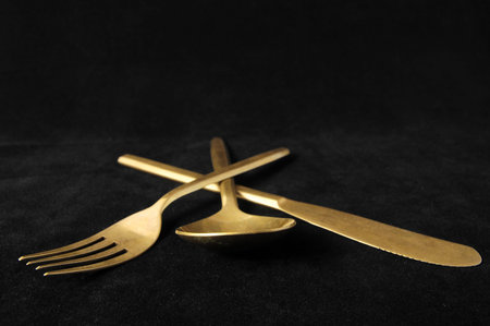 Ancient Vintage Silver Flatware on a Black Background