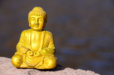 One Ancient Buddha Statue Near The Oceanの写真素材