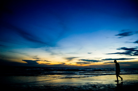 Silhouette of a Woman on the Beach in Thailandの写真素材