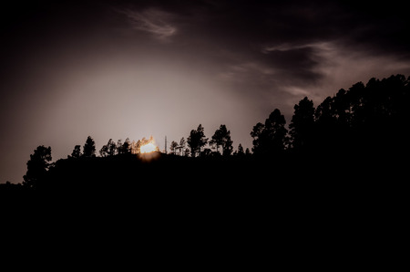 Sun over a Mountain Silhouette in Gran Canaria Spainの写真素材