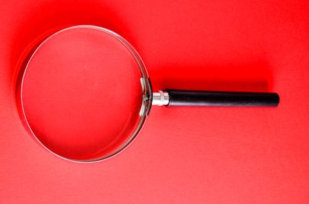 Vintage Magnify Glass Loupe on a Colored Backgroundの写真素材
