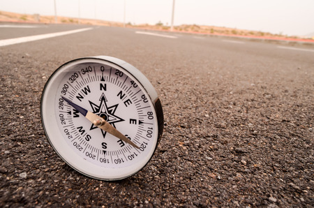 Travel Concept Compass on the Asphlat Roadの写真素材