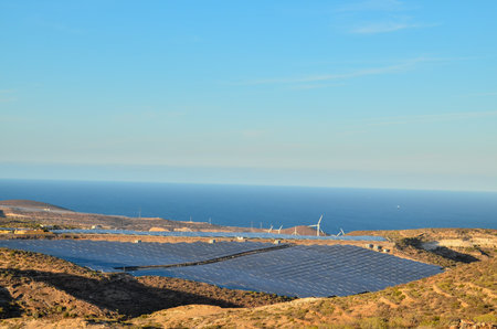 Renewable Energy Concept Solar Panels Field at Sunset