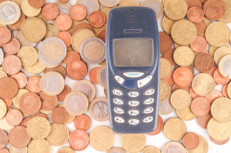 Picture of a Business Money Concept Idea, Phone and Coinsの写真素材