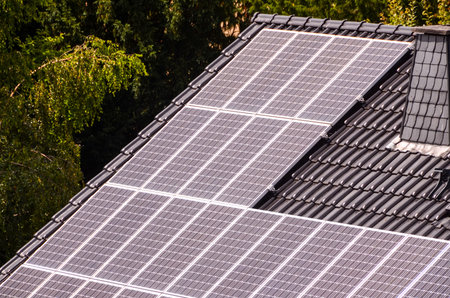 Green Renewable Energy with Photovoltaic Panels on the Roof.