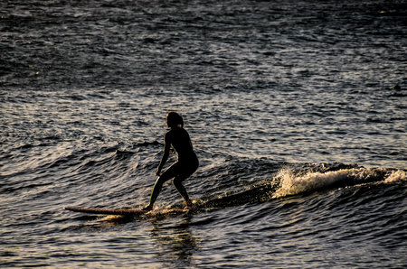 Silhouette Surfer at Sunset in Tenerife Canary Island Spain