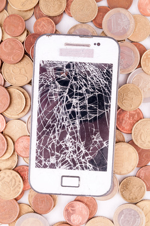 Picture of a Business Money Concept Idea, Smartphone and Coinsの写真素材