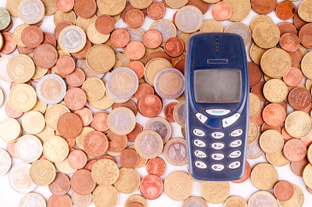 Picture of a Business Money Concept Idea, Phone and Coinsの写真素材