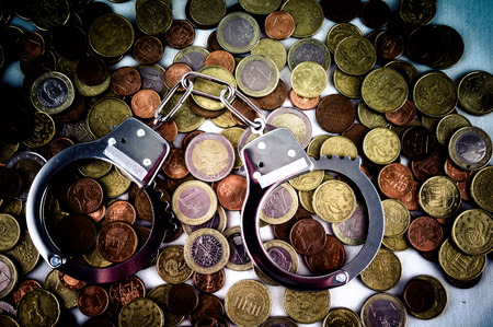 Picture of a Business Money Concept Idea Conis and Handcuffsの写真素材