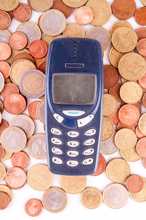 Picture of a Business Money Concept Idea, Phone and Coinsの写真素材