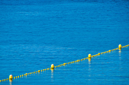 Blue Water Texture Pattern and Yellow Floatersの写真素材