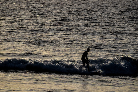 Silhouette Surfer at Sunset in Tenerife Canary Island Spainの写真素材