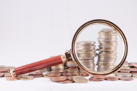 Picture of a Business Money Concept Idea Coins and Loupe Magnify Glassの写真素材