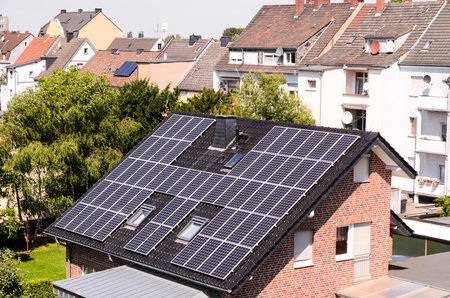 Green Renewable Energy with Photovoltaic Panels on the Roof.