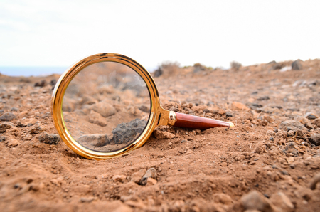 Magnify Glass Abandoned On The Rock Desertの写真素材