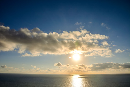 Photo Picture of The  Sun Setting in the Seaの写真素材