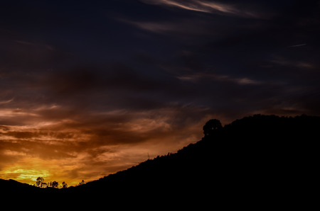 Sun behind a Mountain Silhouette in Gran Canaria Spainの写真素材