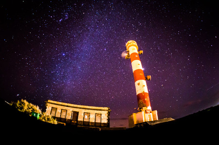 Night Sky Picture of a Lighthouse Towerの写真素材