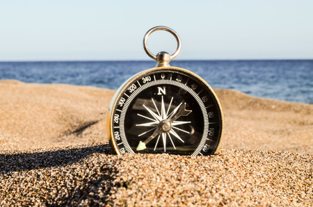 Photo Picture of  a Compass on the Sand Beachの写真素材