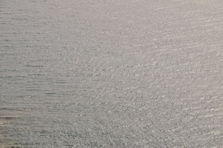 Blue Still Sea Water With Ripple. Natural Background Photo Texture