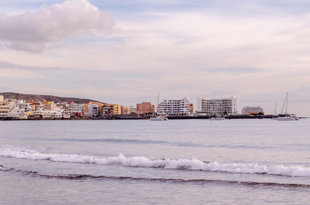 Sea and Building at Sunset in El Medano Tenerife Canary Islandsの写真素材