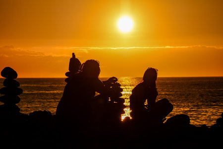 Photo Picture Stack of stones on the sea beach