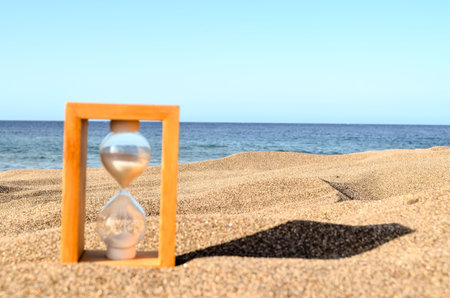 Hourglass Clock on the Sand Beach