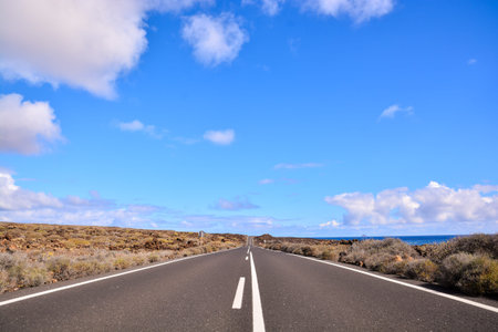 Long Empty Desert Asphalt Road in Canary Islands Spain