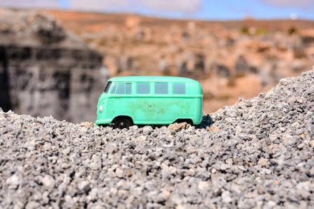 Conceptual Photo Picture of a toy car in the dry desertの写真素材