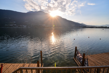 Photo Lake Lago di Caldonazzo on the Background of Dolomites in Italyの写真素材